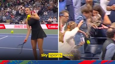 Disaster! Fan throws drink EVERYWHERE in attempt to catch tennis ball