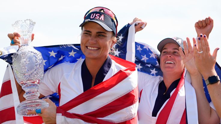 United States' Lexi Thompson holds the winner's trophy after the United States won the Solheim Cup golf tournament against Europe at the Robert Trent Jones Golf Club, Sunday, Sept. 15, 2024, in Gainesville, Va. (AP Photo/Matt York)