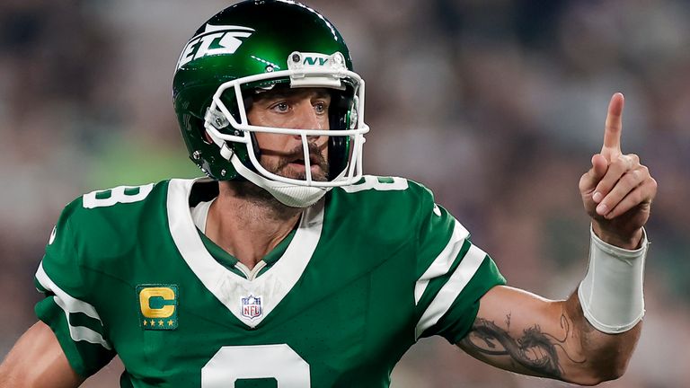 New York Jets quarterback Aaron Rodgers (8) looks to pass against the New England Patriots during the first quarter of an NFL football game, Thursday, Sept. 19, 2024, in East Rutherford, N.J. (AP Photo/Adam Hunger)