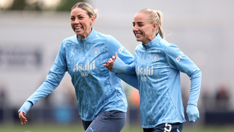 Alanna Kennedy and Alex Greenwood warm up before Manchester City v Brighton