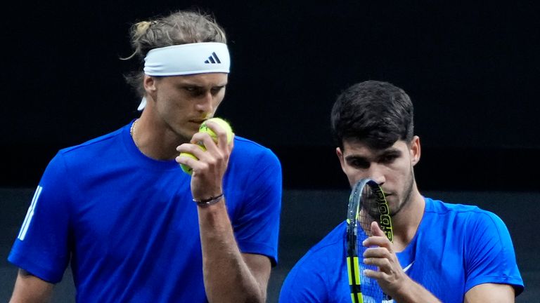 Team Europe's Carlos Alcaraz, right, and Alexander Zverev, left, speak during their doubles match against team World's Taylor Fritz and Ben Shelton on the first day of the Laver Cup tennis tournament at the Uber arena in Berlin, Germany, Friday, Sept. 20, 2024. (AP Photo/Ebrahim Noroozi)