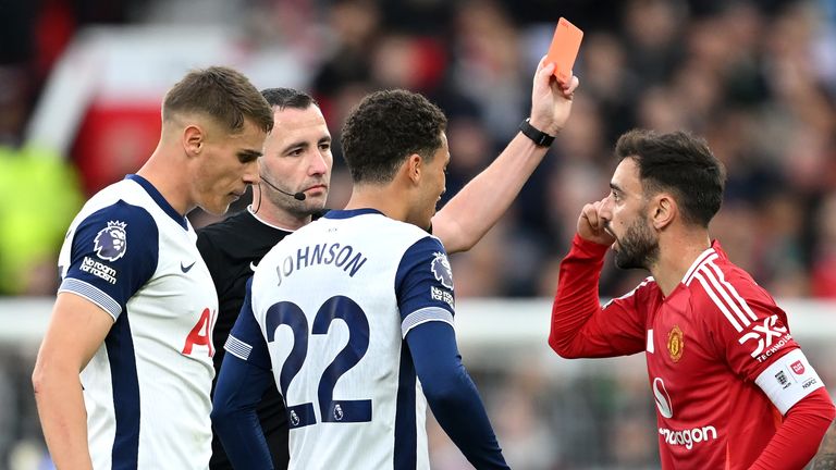 Bruno Fernandes receives a red card from referee Chris Kavanagh