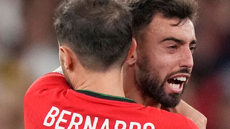 Portugal's Bruno Fernandes, right, celebrates after scoring his side's first goal with Bernardo Silva during the UEFA Nations League soccer match between Portugal and Scotland at the Luz stadium in Lisbon, Portugal, Sunday, Sept. 8, 2024. (AP Photo/Armando Franca)