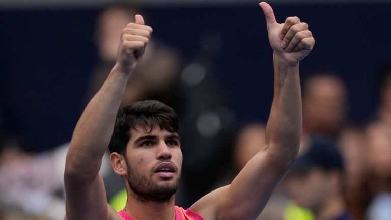 Carlos Alcaraz of Spain celebrates after defeating Giovanni Mpetshi Perricard of France during the China Open tennis tournament held at the National Tennis Center in Beijing, Friday, Sept. 27, 2024. (AP Photo/Ng Han Guan)