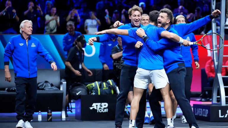 Team Europe's Carlos Alcaraz celebrates with teammates after winning against Team World's Taylor Fritz on the third day of the Laver Cup tennis tournament, at the Uber arena in Berlin, Germany, Sunday, Sept. 22, 2024. (AP Photo/Ebrahim Noroozi)