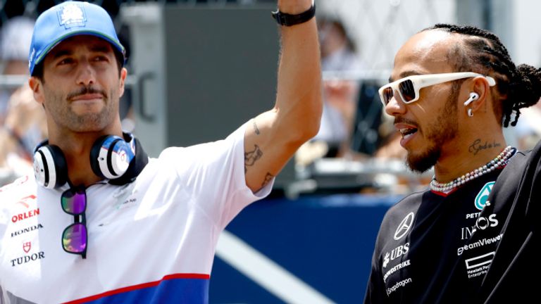 MIAMI INTERNATIONAL AUTODROME, UNITED STATES OF AMERICA - MAY 05: Daniel Ricciardo, Visa Cash App RB F1 Team, and Sir Lewis Hamilton, Mercedes-AMG F1 Team, arrive for the drivers parade during the Miami GP at Miami International Autodrome on Sunday May 05, 2024 in Miami, United States of America. (Photo by Zak Mauger / LAT Images)