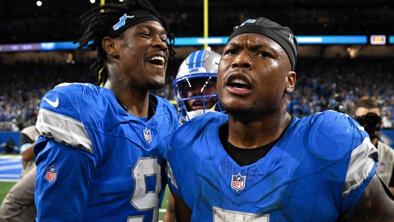 Detroit Lions running back David Montgomery celebrates his one-yard touchdown run with Jameson Williams against the Los Angeles Rams during overtime (AP Photo/David Dermer)