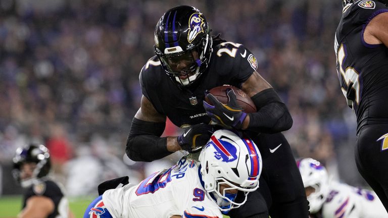 BALTIMORE, MD - SEPTEMBER 29: Baltimore Ravens running back Derrick Henry (22) fights for extra yards during an NFL game between the Buffalo Bills and the Baltimore Ravens on September 29, 2024, at M&T Bank Stadium in Baltimore, MD. (Photo by Charles Brock/Icon Sportswire)