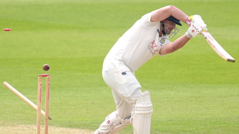 Durham's Alex Lees is bowled out by Surrey's Jordan Clark