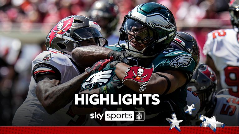 Philadelphia Eagles' Saquon Barkley, center, is tackled by Tampa Bay Buccaneers' Jordan Whitehead, left, and Lavonte David during the first half of an NFL football game, Sunday, Sept. 29, 2024, in Tampa, Fla.