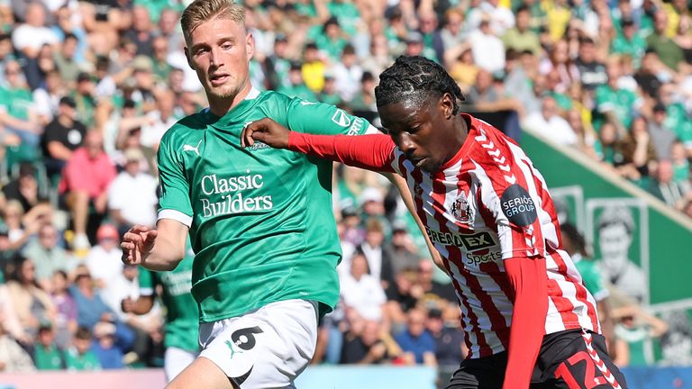 Eliezer Mayenda of Sunderland runs at Plymouth's Kornel Szucs