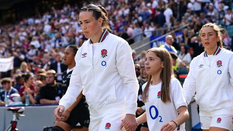 Emily Scarratt (centre) walks out ahead of her 100th England start in the Women's International match at Allianz Stadium, Twickenham, London. Picture date: Saturday September 14, 2024.
