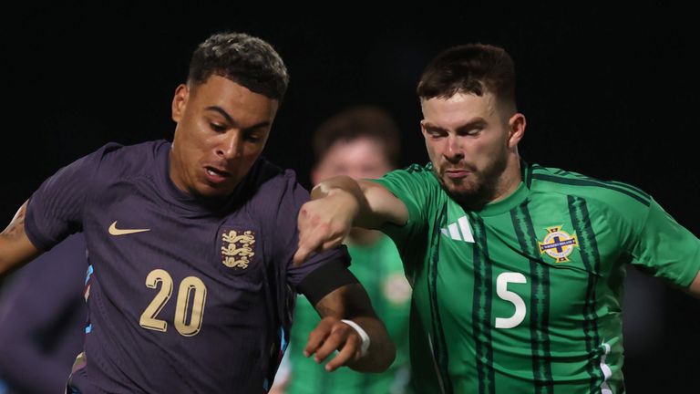 England's Morgan Rogers (left) and Northern Ireland's Michael Forbes battle for the ball