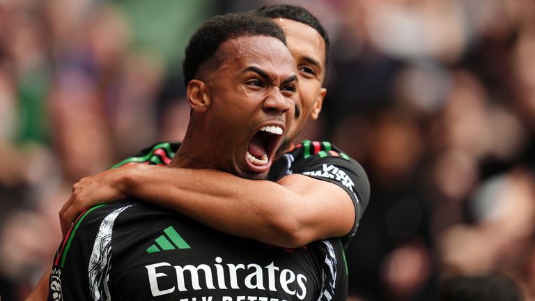 Arsenal's Gabriel celebrates scoring their side's first goal of the game with team-mate William Saliba (background) 