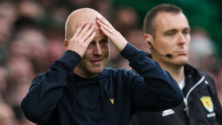 Hearts head coach Steven Naismith looks dejected against Celtic