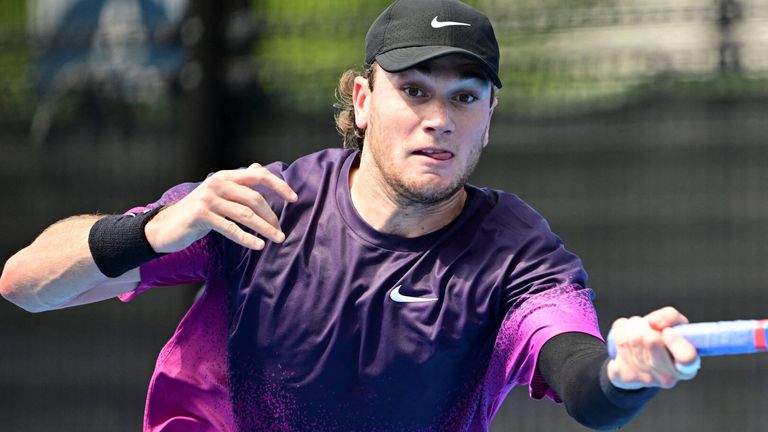 Britain's Jack Draper hits a return to Italy's Mattia Bellucci during their men's singles match at the Japan Open tennis tournament at Ariake Coliseum in Tokyo on September 25, 2024. (Photo by Yuichi YAMAZAKI / AFP)