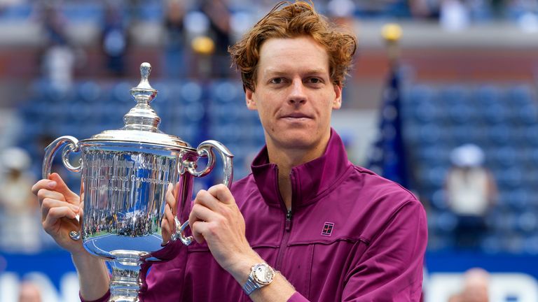 Jannik Sinner, of Italy, holds up the championship trophy after defeating Taylor Fritz, of the United States, in the men's singles final of the U.S. Open tennis championships, Sunday, Sept. 8, 2024, in New York. (AP Photo/Kirsty Wigglesworth)