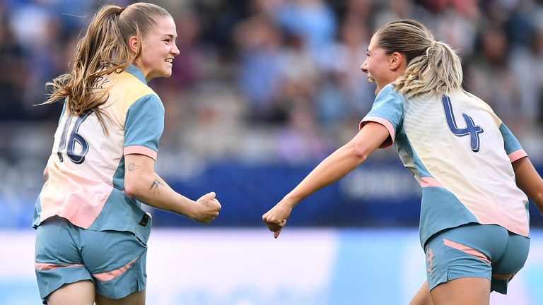 Jess Park celebrates scoring Man City's second goal against Paris FC with team-mate Laia Aleixandri