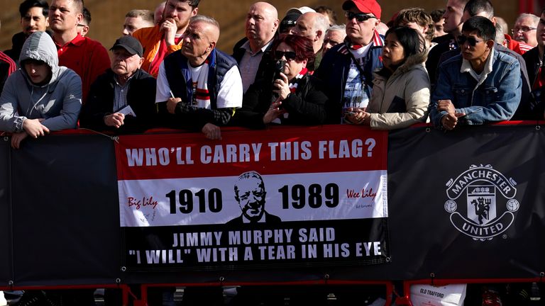 Manchester United fans look on as a new statue of former Manchester United player Jimmy Murphy, designed by sculptor Alan Herriot, is unveiled outside the Stretford End at Old Trafford, Manchester. Picture date: Wednesday May 3, 2023.