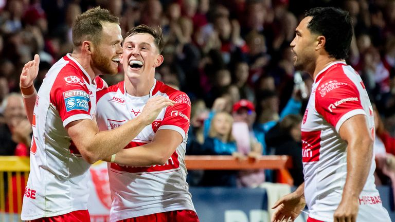 Picture credit: Allan McKenzie/SWpix.com - 20 September 2024 - Rugby League - Betfred Super League Round 27 - Hull KR v Leeds Rhinos - Sewell Group Craven Park, Hull, England - Hull KR Joe Burgess joins Jack Broadbent and Peta Shiku to celebrate tries against Leeds.