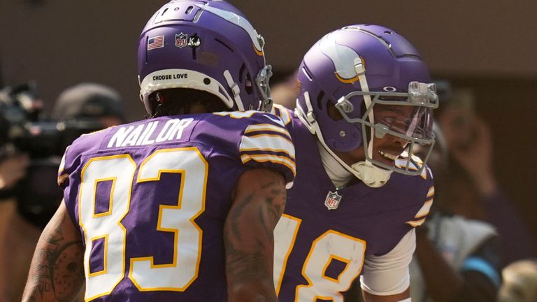 Minnesota Vikings wide receiver Justin Jefferson (18) celebrates with teammate Jalen Nailor (83) after catching a touchdown pass during the first half of an NFL football game against the Houston Texans, Sunday, Sept. 22, 2024, in Minneapolis. (AP Photo/Abbie Parr)