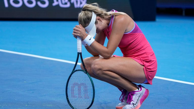 Katie Boulter of Great Britain reacts as she plays against Coco Gauff of the United States during their women's singles match of the China Open tennis tournament, at the National Tennis Center in Beijing, Sunday, Sept. 29, 2024. (AP Photo/Andy Wong)