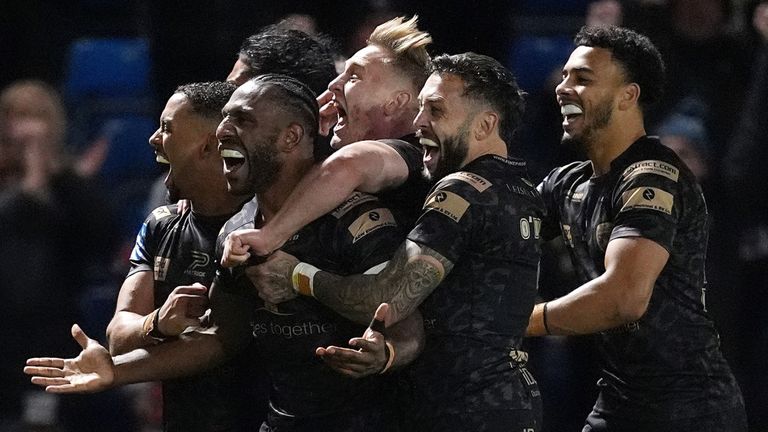 Edwin Ipape celebrates with his Leigh teammates after scoring a try against Salford