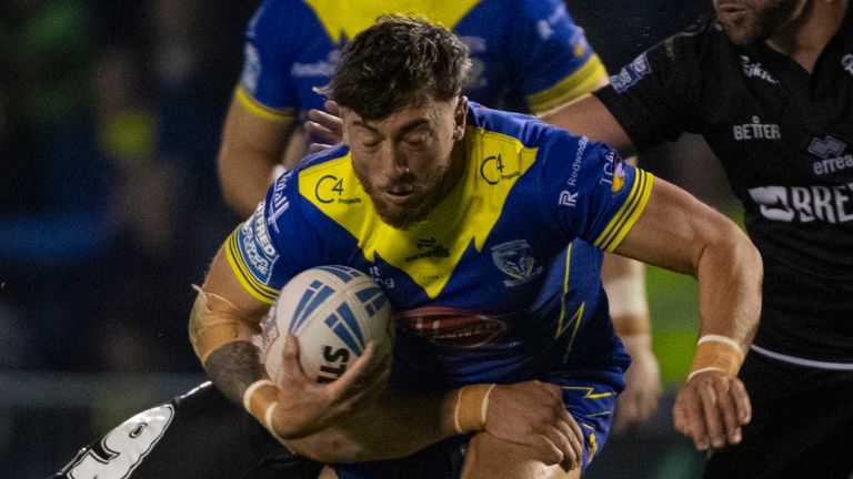 Picture credit: Olly Hassell/SWpix.com - 20/09/2024 - Rugby League - Betfred Super League Round 27 - Warrington Wolves v London Broncos - Halliwell Jones Stadium, Warrington, England - Warrington Marty Ashton tackled by London's Jacob Jones