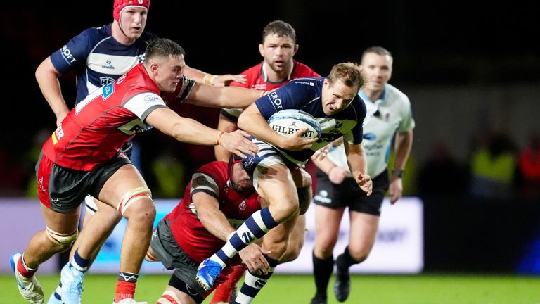 Bristol's Max Malins is tackled by Gloucester's Freddie Thomas and Matias Alemanno