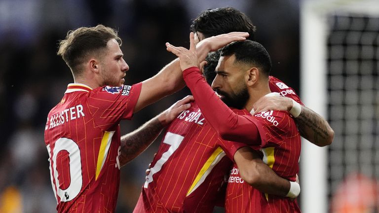 Mohamed Salah is congratulated by team-mates