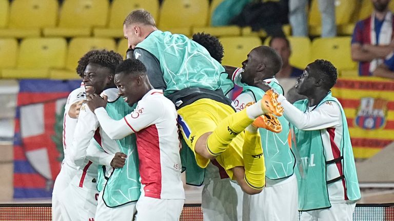 Monaco players celebrate after their teammate George Ilenikhena scored his side's second goal during the Champions League opening phase soccer match between Monaco and Barcelona at the Louis II stadium, in Monaco, Monaco, Thursday, Sept. 19, 2024. (AP Photo/Laurent Cipriani)