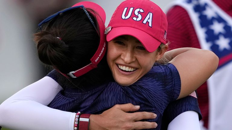 United States' Nelly Korda, right, and teammate Megan Khang hug while celebrating their victory during a Solheim Cup golf tournament fourball match at Robert Trent Jones Golf Club, Friday, Sept. 13, 2024, in Gainesville, Va. (AP Photo/Matt York)