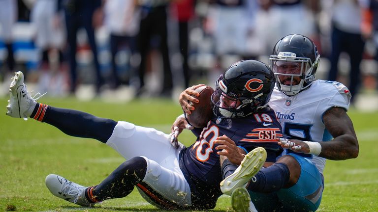 Tennessee Titans linebacker Harold Landry III (58), right, tackles Chicago Bears quarterback Caleb Williams (18) during an NFL football game Monday, Sept. 9, 2024, in Chicago.