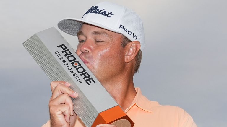 Patton Kizzire kisses the trophy after winning the Procore Championship golf tournament at Silverado Resort North Course, Sunday, Sept. 15, 2024, in Napa, Calif. (AP Photo/Godofredo A. V..squez)