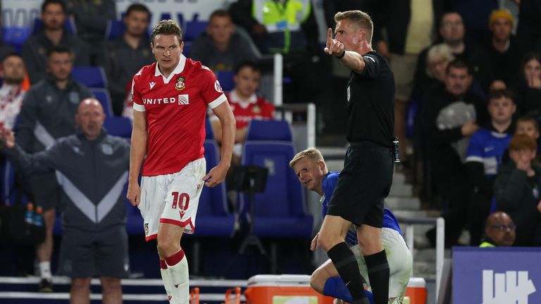 Paul Mullin cautioned by referee Scott Oldham.