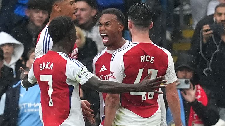 Gabriel celebrates after heading Arsenal in front at the Etihad