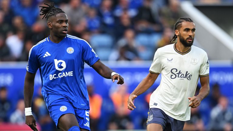 Caleb Okoli passes the ball under pressure from Dominic Calvert-Lewin