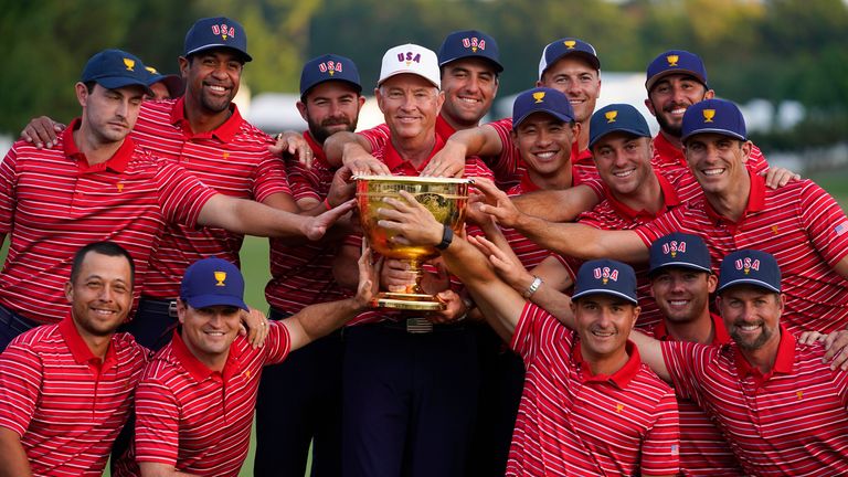 USA captain Davis Love III and his team pose for a photo with the Presidents Cup trophy after defeating the International team at the Quail Hollow Club in 2022 (AP Photo/Julio Cortez)