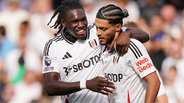 Raul Jimenez (R) celebrates his opener with teammate Calvin Bassey