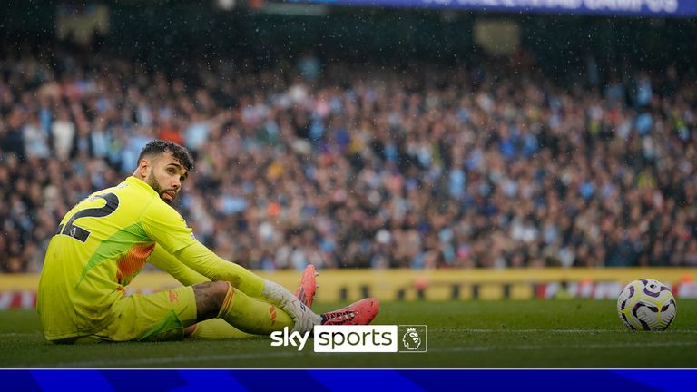 Arsenal's goalkeeper David Raya sits on the pitch during the English Premier League soccer match between Manchester City and Arsenal at the Etihad stadium in Manchester, England, Sunday, Sept. 22, 2024.