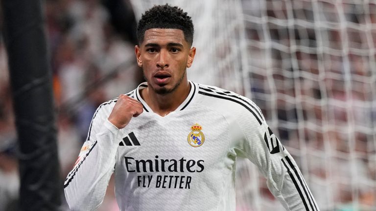 Real Madrid's Jude Bellingham celebrates the goal against Espanyol of his teammate Dani Carvajal, at the background, during a Spanish La Liga soccer match at Santiago Bernabeu stadium in Madrid, Spain, Saturday, Sept. 21, 2024. (AP Photo/Manu Fernandez)