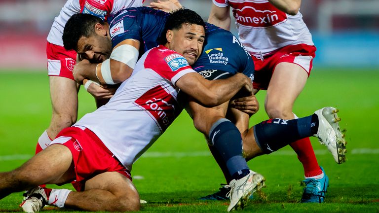 Picture credit: Allan McKenzie/SWpix.com - 20 September 2024 - Rugby League - Betfred Super League Round 27 - Hull KR v Leeds Rhinos - Sewell Group Craven Park, Hull, England - Leeds' Rhyse Martin is tackled by Huill KR Craven Park, Hull, England - Leeds' Rhyse Martin is tackled by Huill KR's Peta Hiku, Matt Parcell and James Batchelor.