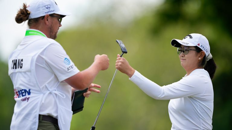 Rose Zhang bumps fists with her caddie on the third green during the first round of the U.S. Women's Open golf tournament at Lancaster Country Club, Thursday, May 30, 2024, in Lancaster, Pa. (AP Photo/Matt Slocum)