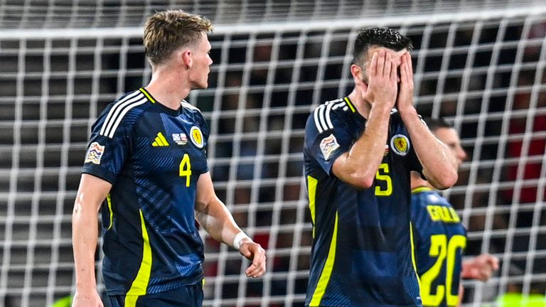 Scotland's Grant Hanley looks dejected after awarding Poland a last-minute penalty.