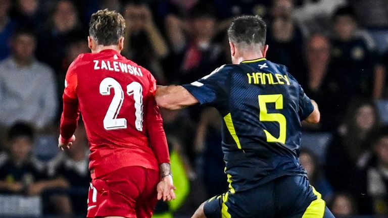 Scotsman Grant Hanley fouls Poland's Nicola Zalewski 