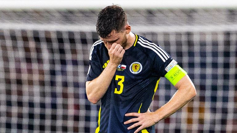 Scotland's Andy Robertson looks dejected after they concede a late goal against Poland