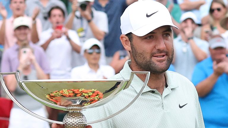 ATLANTA, GA - SEPTEMBER 01: Scottie Scheffler (USA) grabs the trophy after winning the 2024 FedExCup Playoffs Tour Championship on September 1, 2024 at East Lake Golf Club in Atlanta, Georgia. (Photo by Michael Wade/Icon Sportswire) (Icon Sportswire via AP Images) 