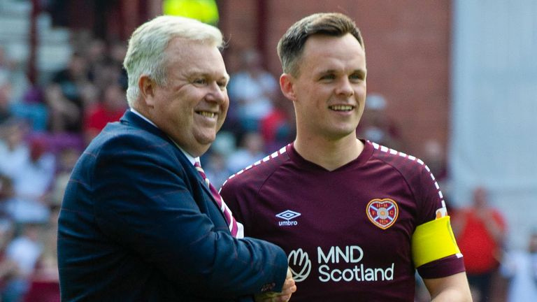 EDINBURGH, SCOTLAND - MAY 11: Hearts' Lawrence Shankland is presented with his PFA Player of the Year Award by Chief Executive Andrew McKinlay ahead of kick off during a cinch Premiership match between Heart of Midlothian and Dundee at Tynecastle Park, on May 11, 2024, in Edinburgh, Scotland. (Photo by Paul Byars / SNS Group)