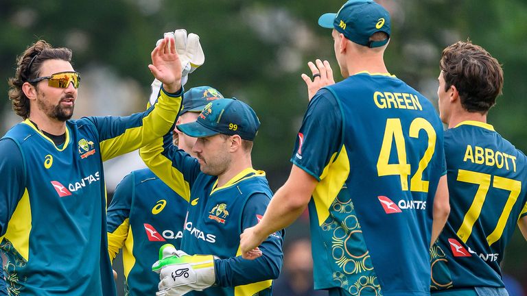 Australia's Tim David (left) celebrates catching out Scotland's Brandon McMullen (not pictured) with team-mates during the second T20 International match between Scotland and Australia at The Grange Club, Edinburgh. Picture date: Friday September 6, 2024.