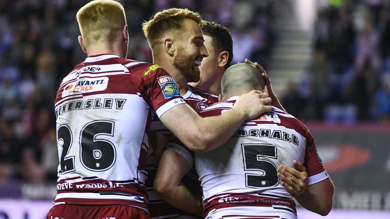 Picture by Olly Hassell/SWpix.com - 19/09/2024 - Rugby League - Betfred Super League Round 27 - Wigan Warriors v Salford Red Devils - The Brick Community Stadium, Wigan, England - Liam Marshall of Wigan celebrates scoring a try with Adam Keighran of Wigan